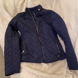 US Polo Assn; small, 100% polyester; navy blue side zip pockets. Zip front